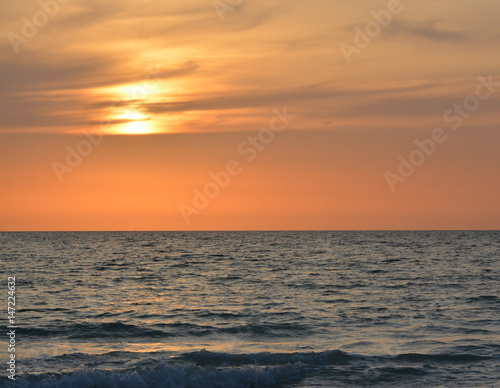 A beautiful sunset over the Gulf of Mexico on Indian Rocks Beach, Florida. © Norm