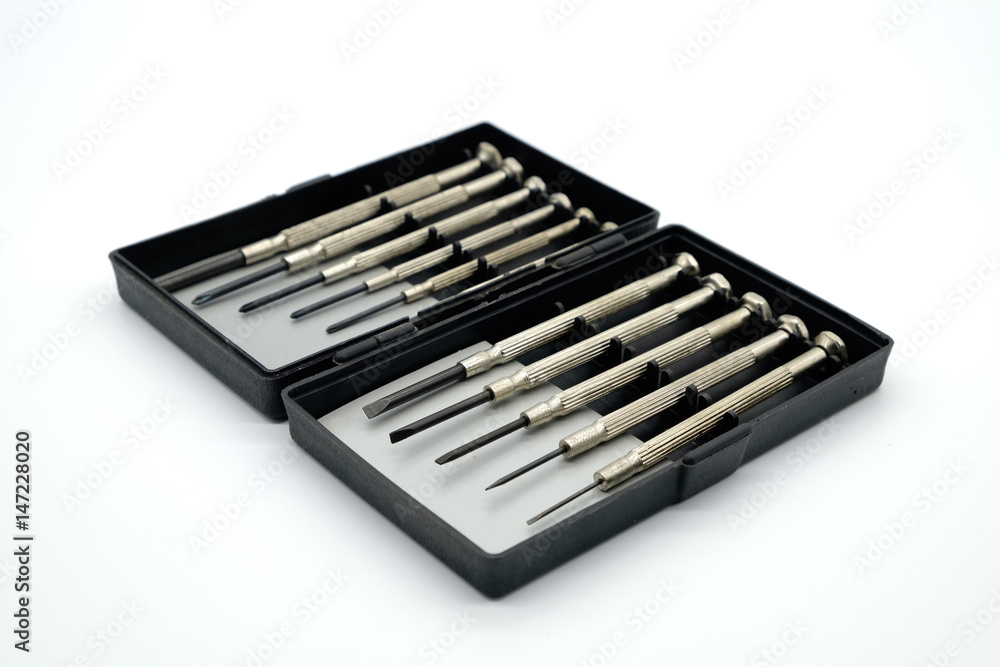 Set of mini old screwdrivers in a black box with white background. Set of mini old screwdrivers in a black box with white background.