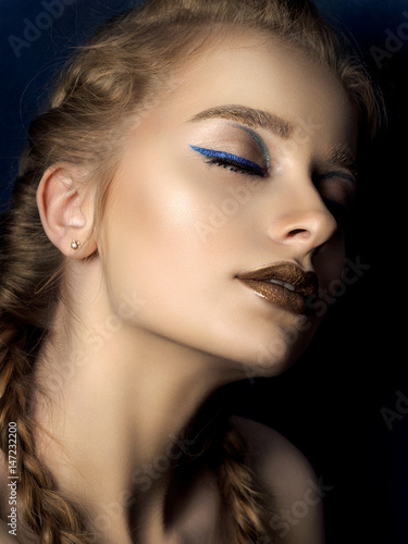 Beauty portrait of young woman with modern make up