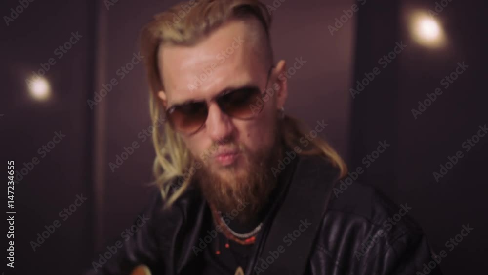 Hands and Face of a Bearded Man Playing Guitar Hands and Face of a Bearded Man Playing Guitar