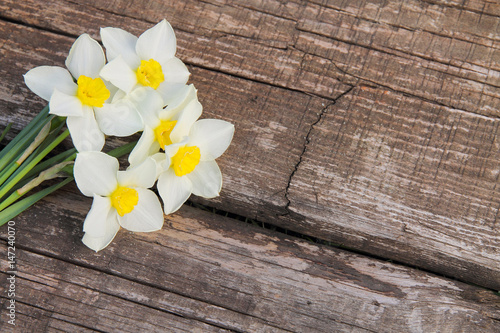 Bouquet of daffodils on a wooden background