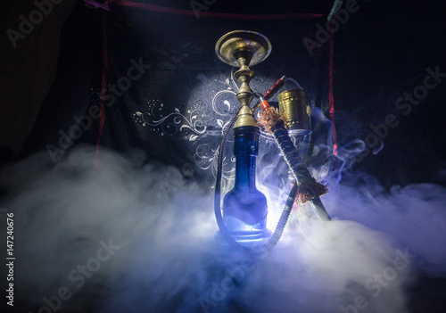 Hookah hot coals on shisha bowl with black background. Stylish oriental shisha photo