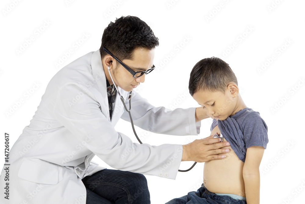 Asian pediatrician checks his patient with stethoscope Asian pediatrician checks his patient with stethoscope