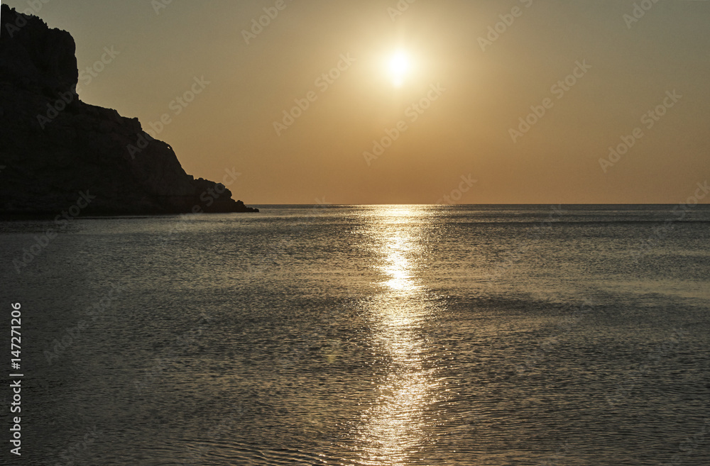 Sunrise over the Mediterranean Sea on the island of Rhodes .