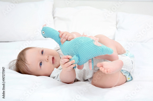 Cute baby playing with toy ...