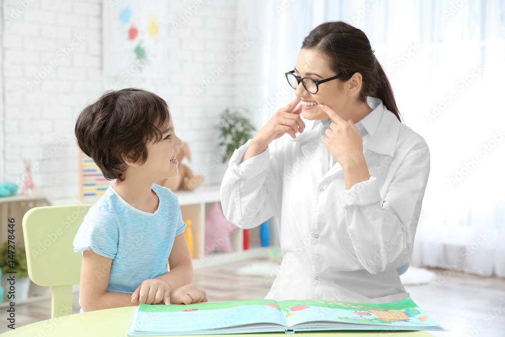 Young woman teacher and little boy on private lesson Young woman teacher and little boy on private lesson