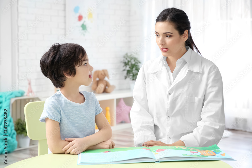 Young woman teacher and little boy on private lesson Young woman teacher and little boy on private lesson