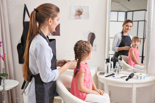 Cute little girl in hairdre...