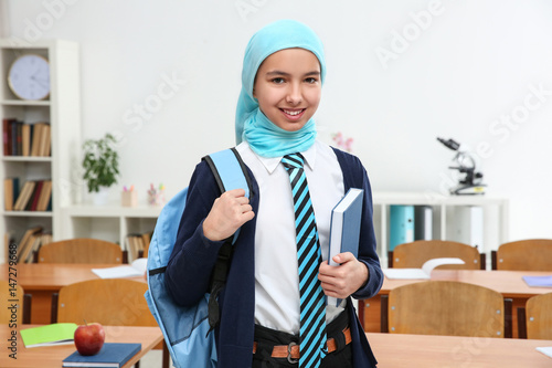 Cute girl with backpack and...