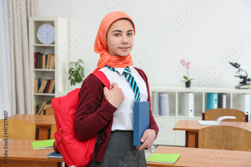 Cute girl with backpack and...