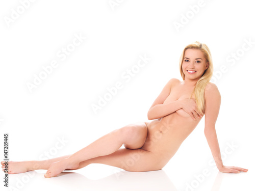 Beautiful nude woman sitting on flor photo