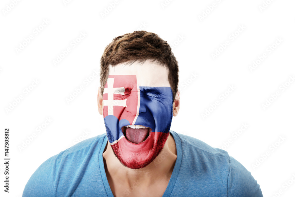 Screaming man with Slovakia flag on face. Screaming man with Slovakia flag on face.