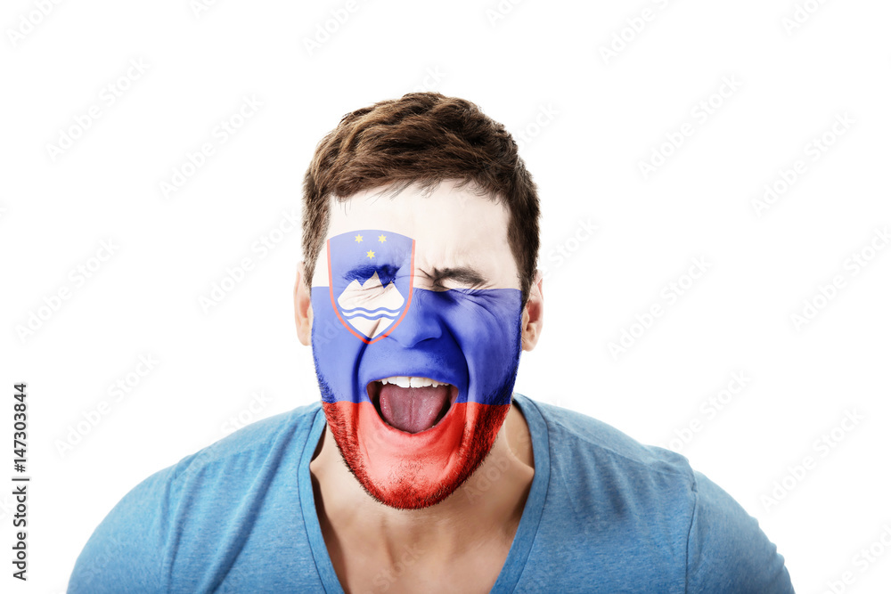 Screaming man with Slovenia flag on face. Screaming man with Slovenia flag on face.
