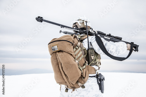 Army soldier with Sniper rifle in action in the Arctic. Back view © Getmilitaryphotos