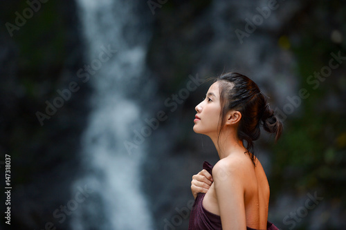 Asian woman wearing traditional thai take a baht on during sunset,vintage style,Beautiful woman take a baht,woman take a baht in river,Woman thai culture