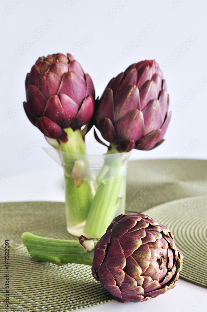 Fototapeta premium Purple artichokes on a table