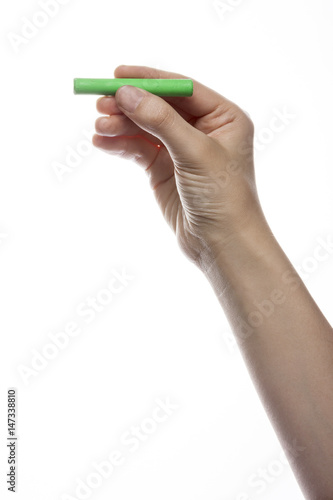 woman hand hold a crayon isolated white.