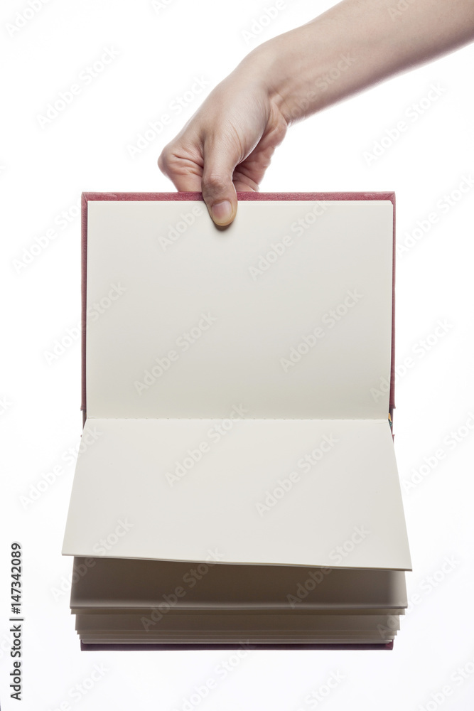 woman hand hold a red book isolated white. woman hand hold a red book isolated white.