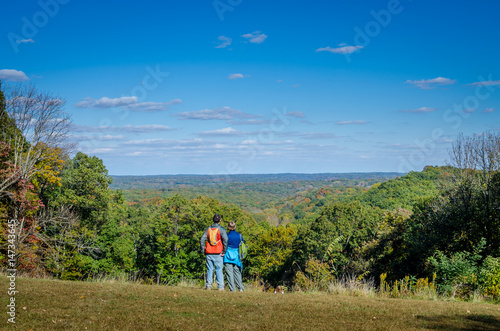 A couple admiring the scenery at Brown County State Park in fall