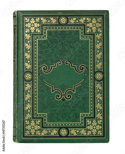 vintage book with green textile cover with decorative ornate, golden frame and blank label for your copy