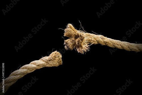 Closeup of thick rope cut and frayed, freedom and danger concepts