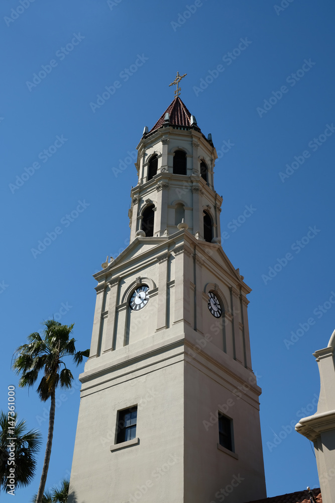 Close up of Bell tower of the Cathedral Basilica of St. Augustine in St Augustine, Florida. Historic church,stucco cladding and terra cotta tiled roof, Spanish Mission meets Neoclassical architecture.