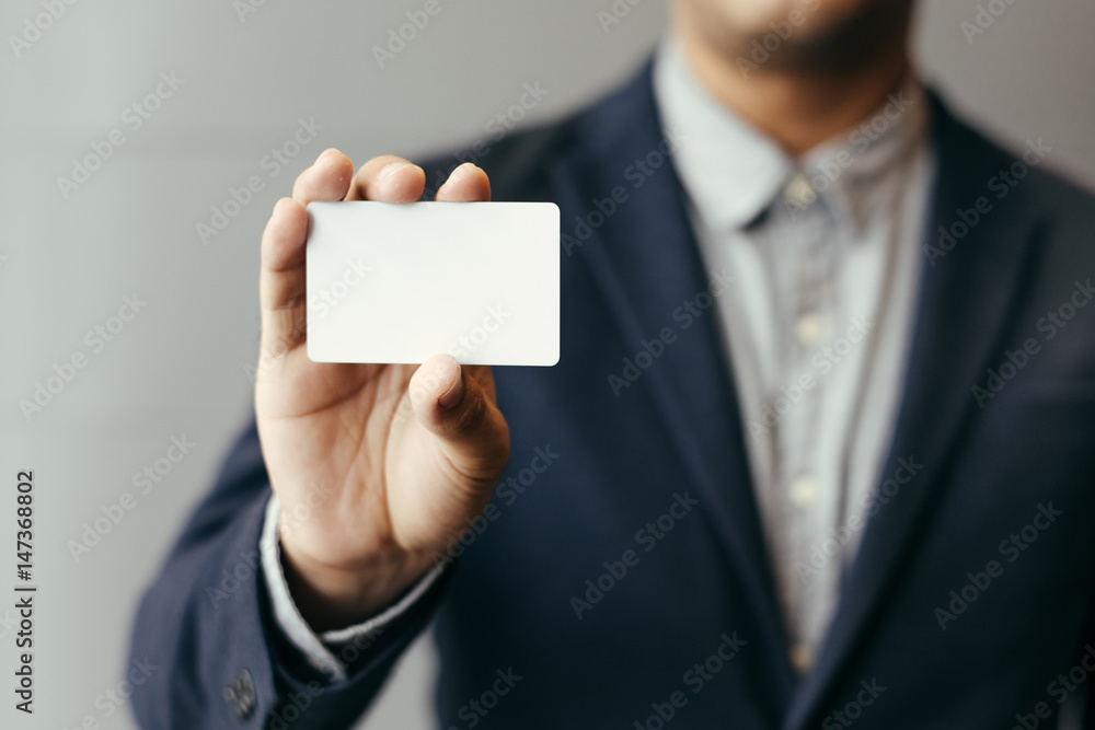Man holding white business card,Man wearing blue shirt and showing blank white business card. Blurred background. Horizontal mockup,Businessman in office with business card in hand. Cards. Man holding white business card,Man wearing blue shirt and showing blank white business card. Blurred background. Horizontal mockup,Businessman in office with business card in hand. Cards.