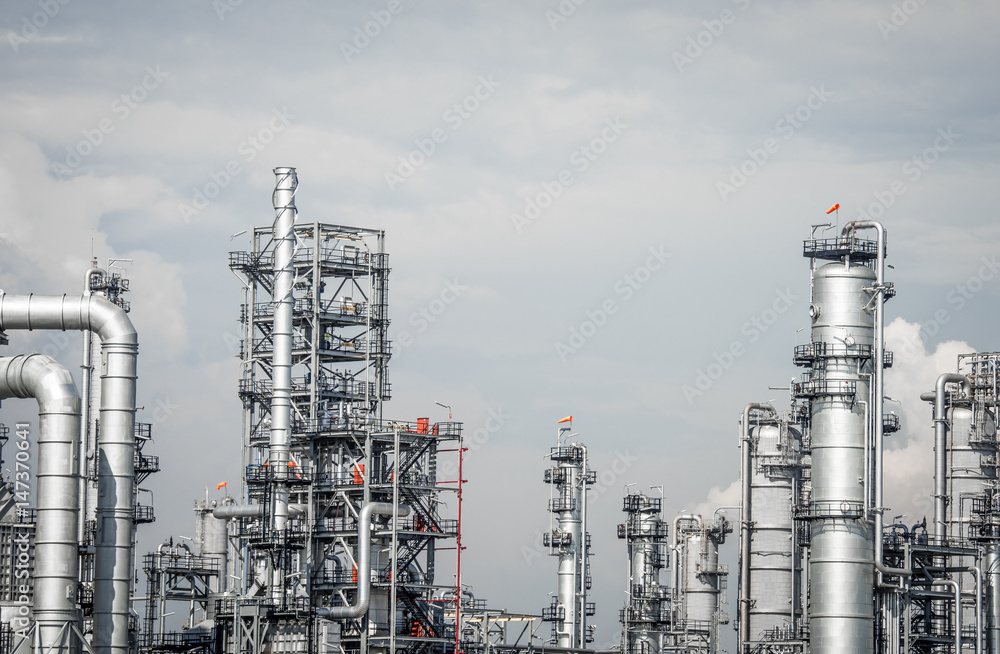 Industrial zone,The equipment of oil refining,Close-up of industrial pipelines of an oil-refinery plant,Detail of oil pipeline with valves in large oil refinery. Industrial zone,The equipment of oil refining,Close-up of industrial pipelines of an oil-refinery plant,Detail of oil pipeline with valves in large oil refinery.