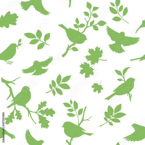 Seamless pattern with bird and twig silhouettes. Spring background with green birds. Vector illustration