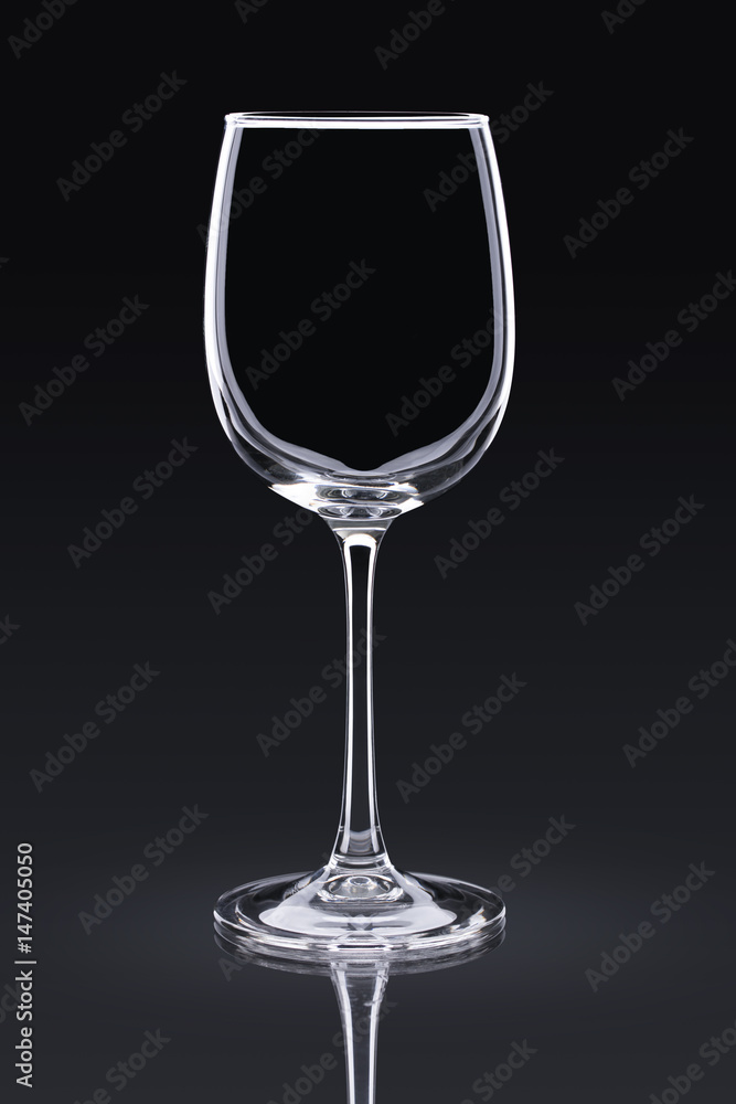 empty wine glass on a black background empty wine glass on a black background