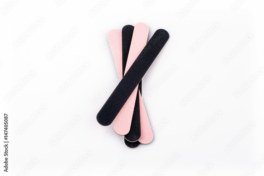 A stack of flexible Emery board used in manicures and pedicures - beauty product isolated on white background.