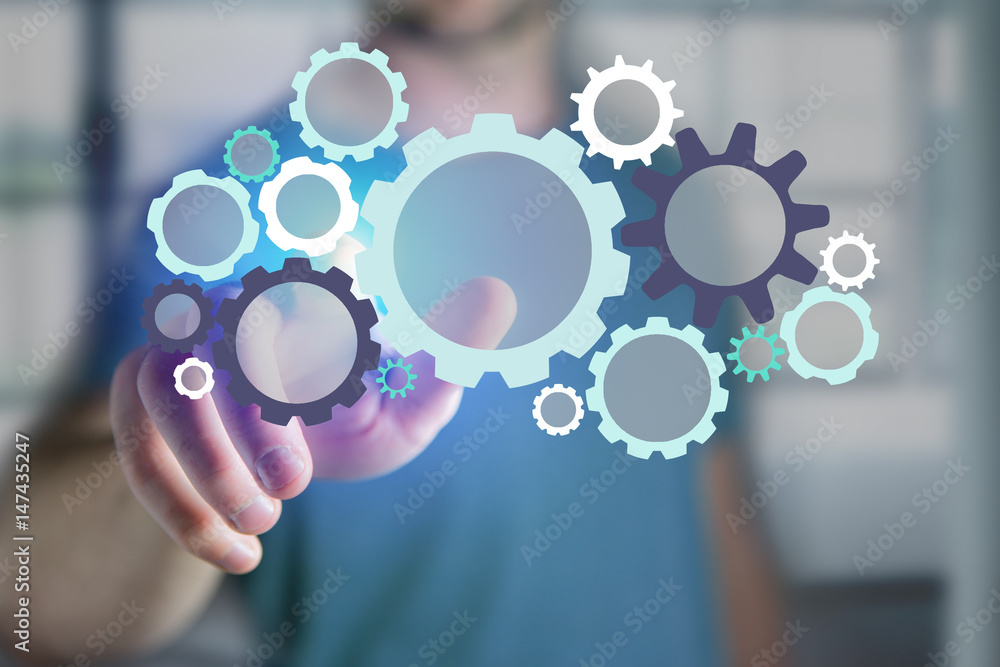 Man pointing a cogwheel interface setting - Technology concept Man pointing a cogwheel interface setting - Technology concept