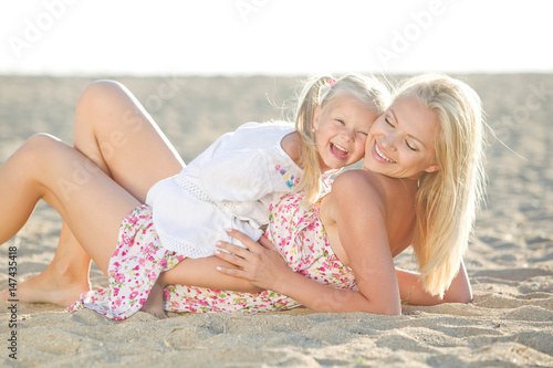 Mom with a child by the sea 