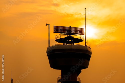 Silhouette of radar tower with twilight sky at sunset time