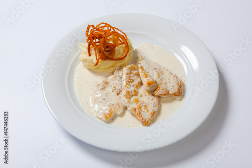 Chicken breast with mashed potato, onion and gravy