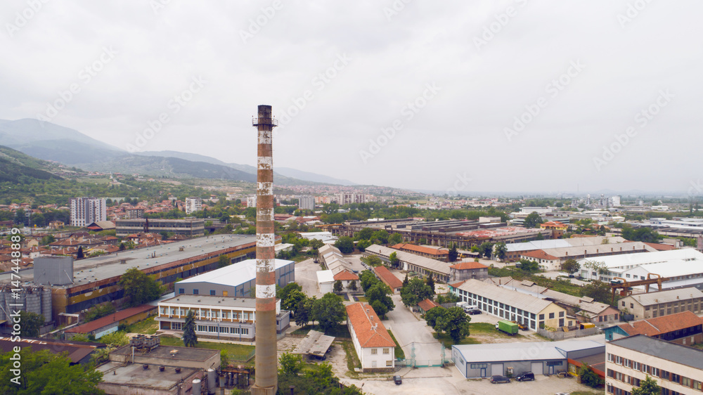 Fototapeta premium Old Chimney Factory In The Town
