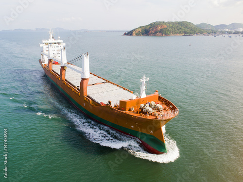 The conventional general cargo vessel ship under proceeding sailing on the route of port chennal due photo