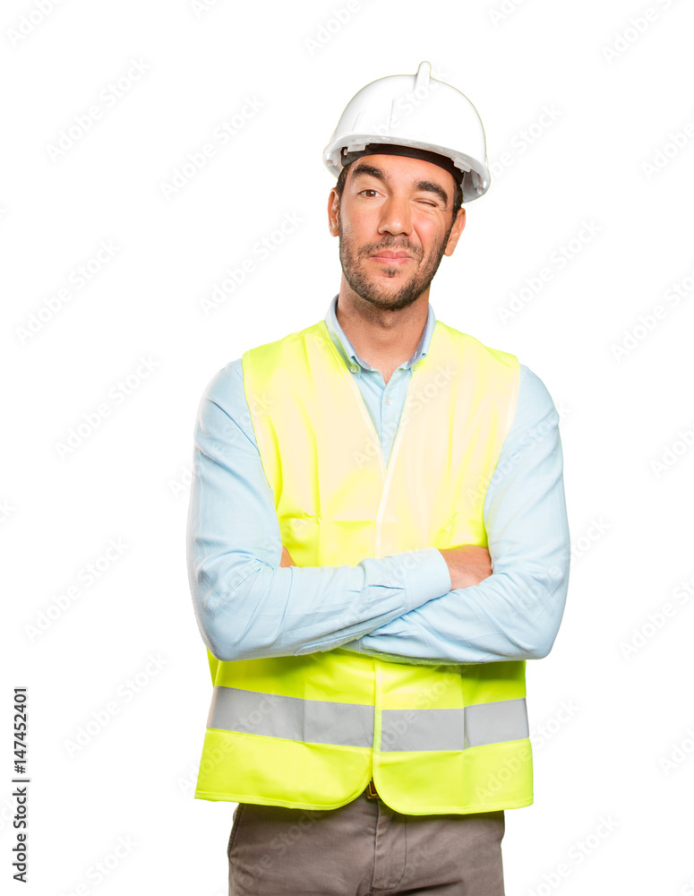 Happy engineer winking an eye against white background Happy engineer winking an eye against white background