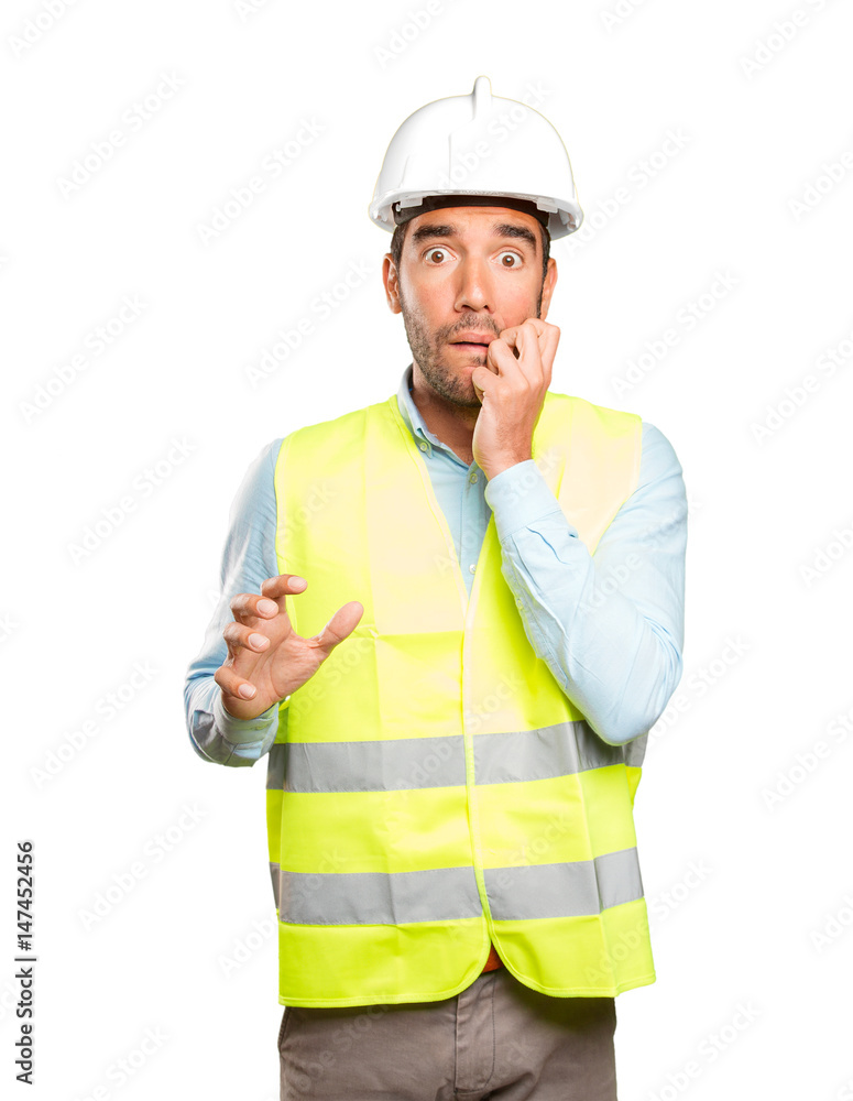 Nervous engineer against white background Nervous engineer against white background