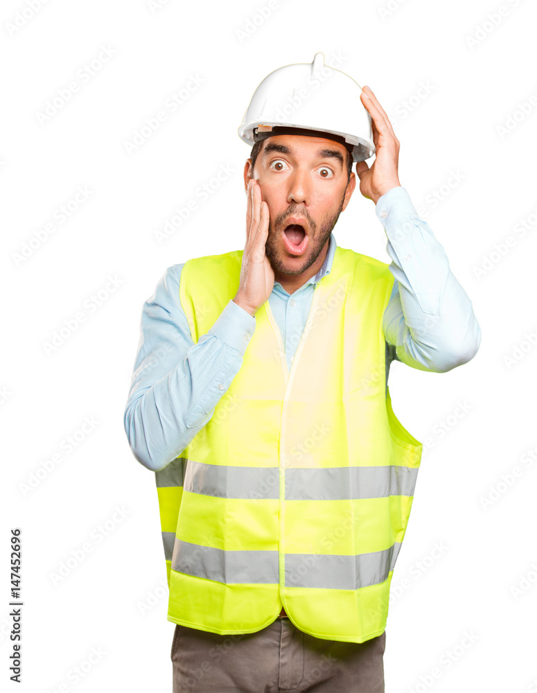 Surprised engineer against white background Surprised engineer against white background