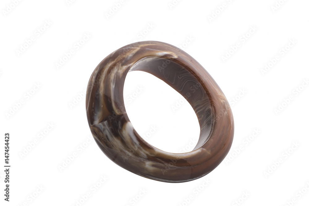Wide bracelet made from natural stone on a white background Wide bracelet made from natural stone on a white background