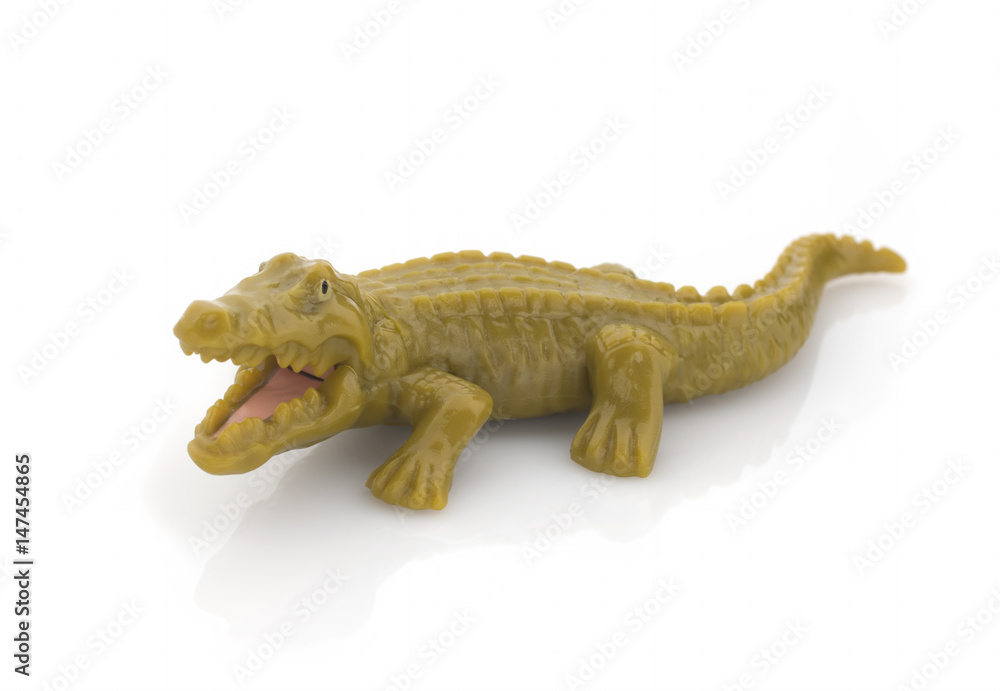 Naklejka premium Green plastic crocodile on a white background. Isolated