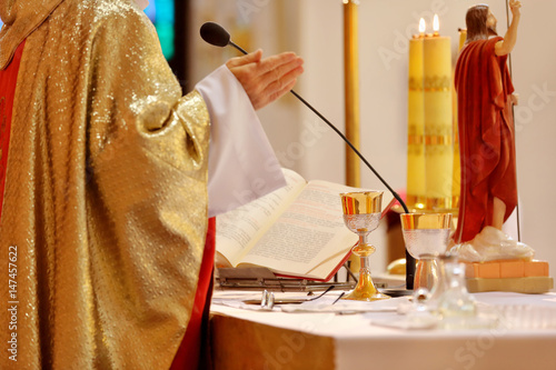 Priest celebrate mass at the church photo