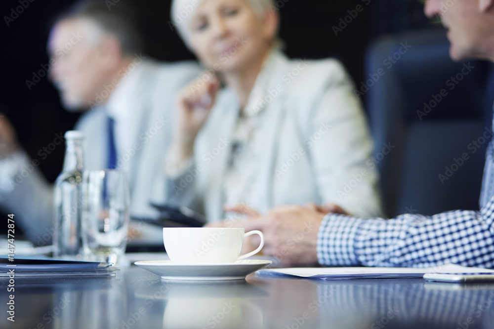 Cup of coffee on the conference table Cup of coffee on the conference table