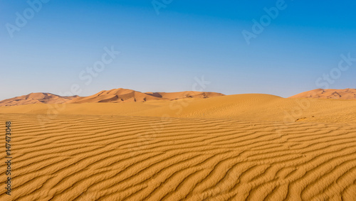 Patterns created by wind and desert sand at the Sahara desert - Morocco