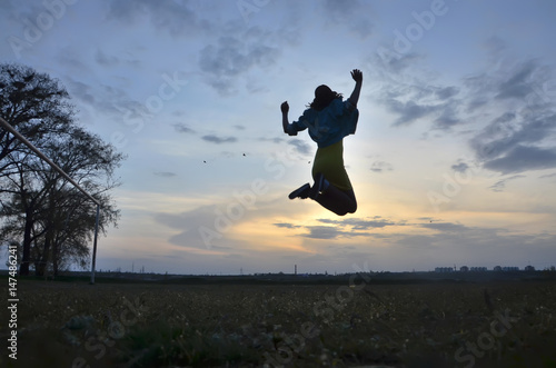 A young woman flying in the sky