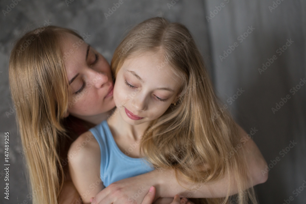 Mom and daughter teenager. Motherhood closeup Mom and daughter teenager. Motherhood closeup