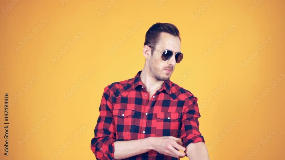 the guy rolls his sleeve plaid shirt the guy rolls his sleeve plaid shirt