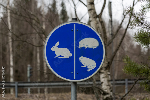 Road sign with rabbit, frog and hedgehog, path for animals