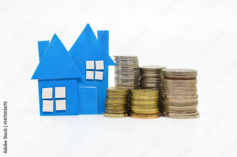 House model and stacks of coins House model and stacks of coins